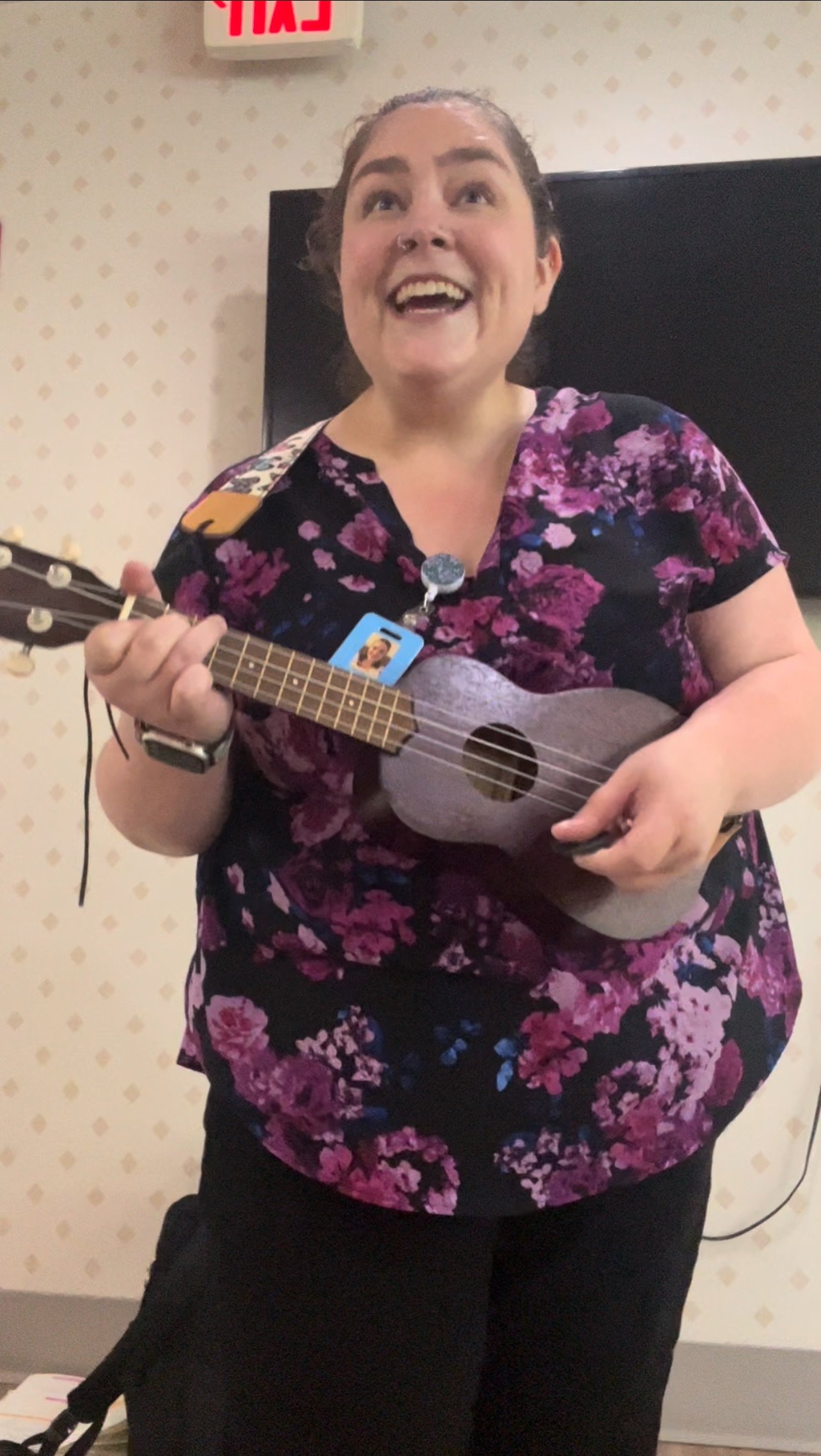 Playing ukulele and singing with seniors.